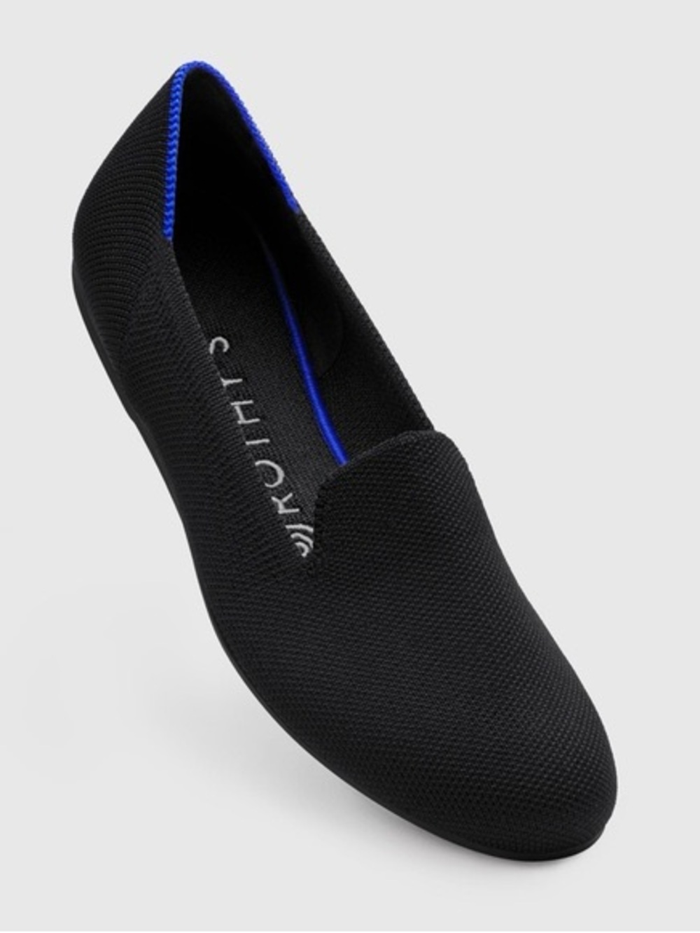 Rothy's Black Slip-On Flat with Blue Accent